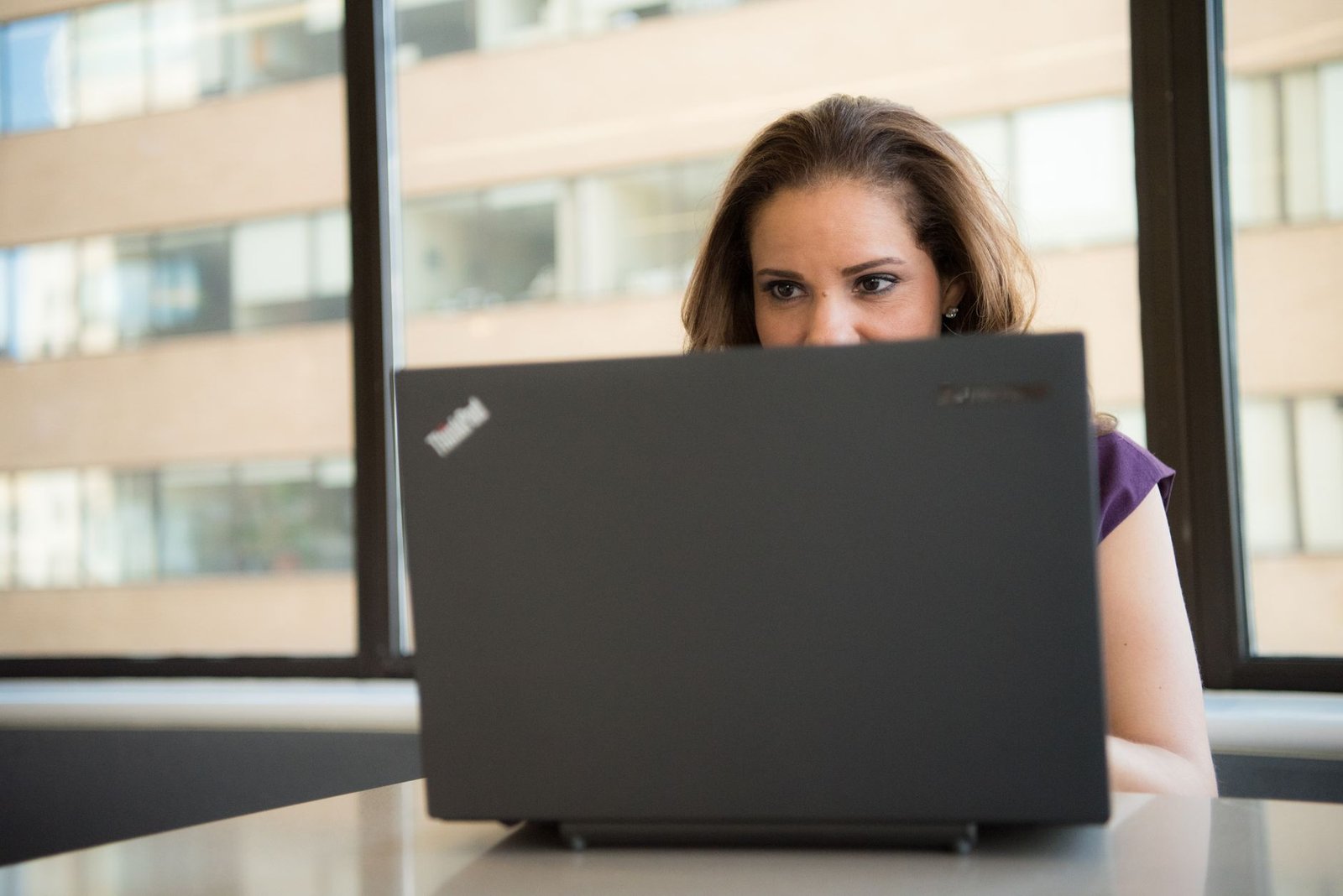 Person comparing AI assistants on a laptop