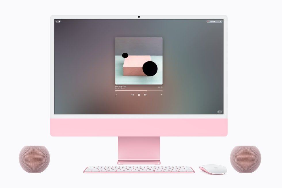 HomePod mini 2 pair beside an iMac as desktop speakers