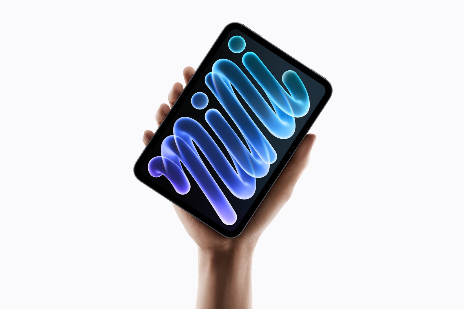 New iPad mini held in one hand showing the 8.5-inch OLED display