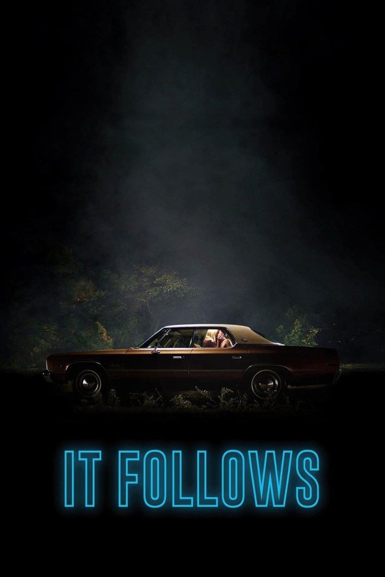 It Follows poster showing a figure standing far back on an empty suburban street