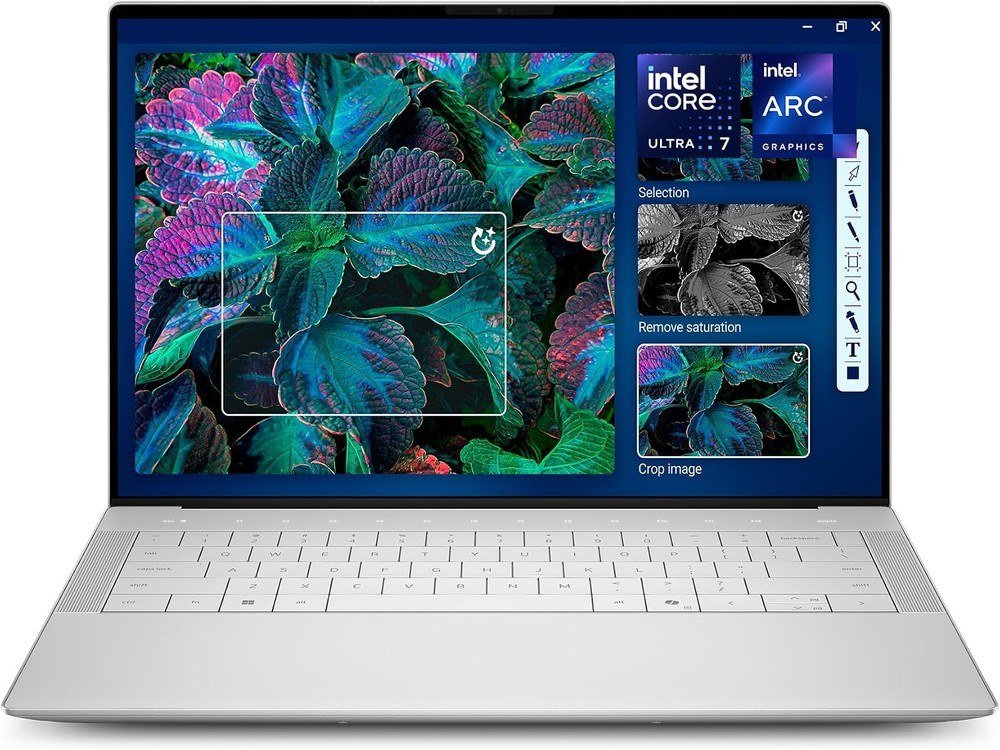 Dell XPS 14 laptop in platinum open to a photo editing screen