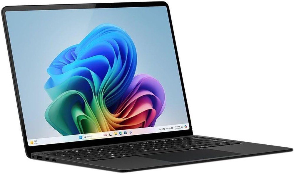 Microsoft Surface Laptop in black open to the Windows 11 wallpaper