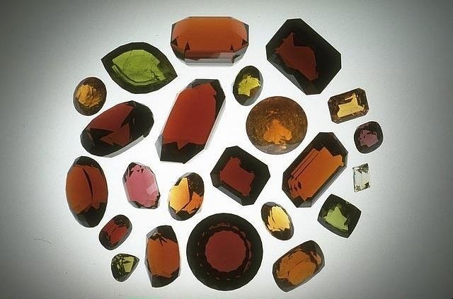 Twenty-two faceted garnets in red, orange, yellow, green and pink from the National Gem Collection