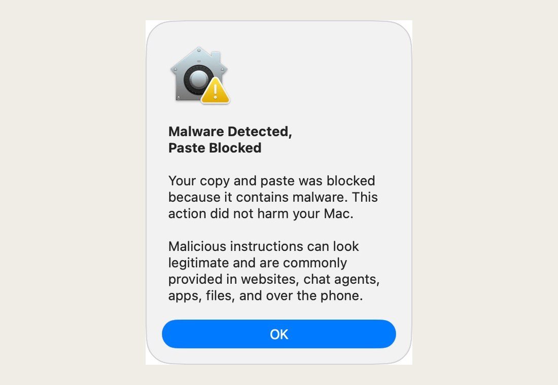 macOS Terminal alert reading Malware Detected, Paste Blocked, explaining the copy and paste was stopped