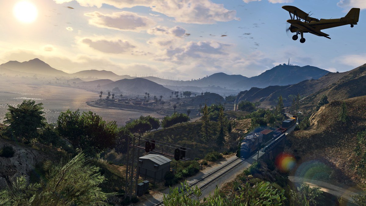 Biplane flying over the hills and railway of Blaine County in GTA 5
